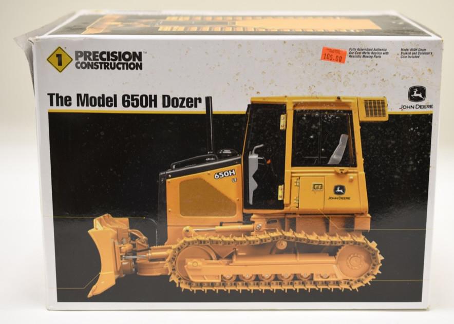 1/16 John Deere Model 650H Dozer Precision: Nice 1/16th scale die-cast Ertl John Deere Model 650H dozer precision in the box. Styrofoam is still sealed shut with tape. Box has staining and appears to have gotten damp at one point.