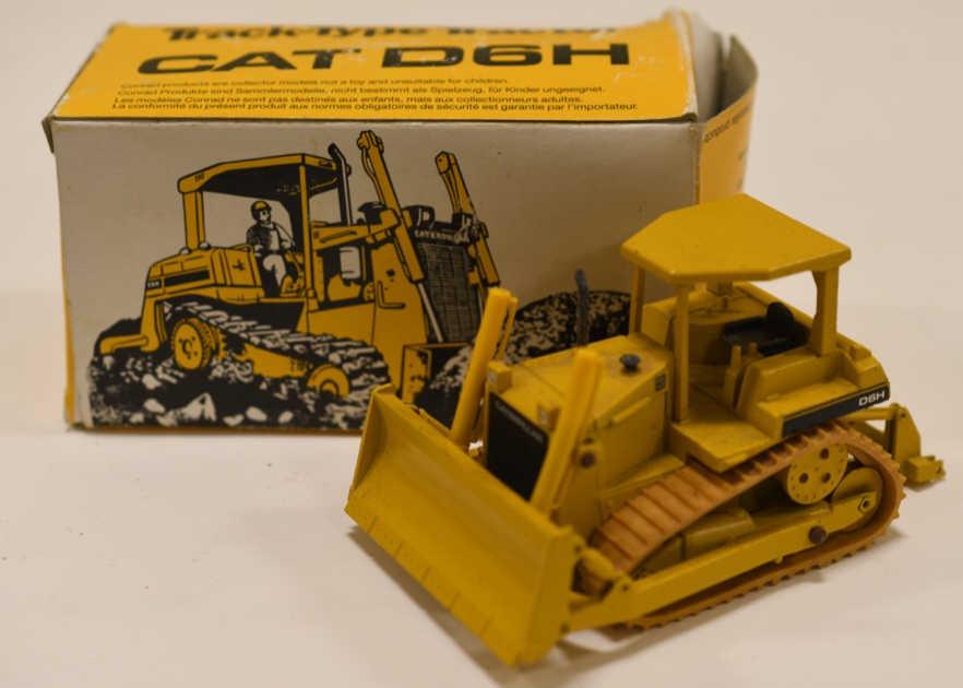 1/50 NZG Conrad Cat D6H Bulldozer: Nice 1/50 scale Conrad NZG Cat D6H bulldozer. Displays nicely with wear from display and age. Made in Germany.