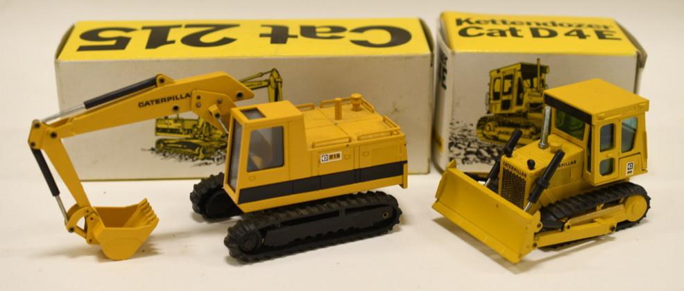 1/50 NZG Conrad Cat Excavator and Dozer: Nice 1/50 scale Conrad NZG Cat 215 excavator and Cat D4E track-type tractor. Both display nicely with box. Nice condition. Made in Germany.