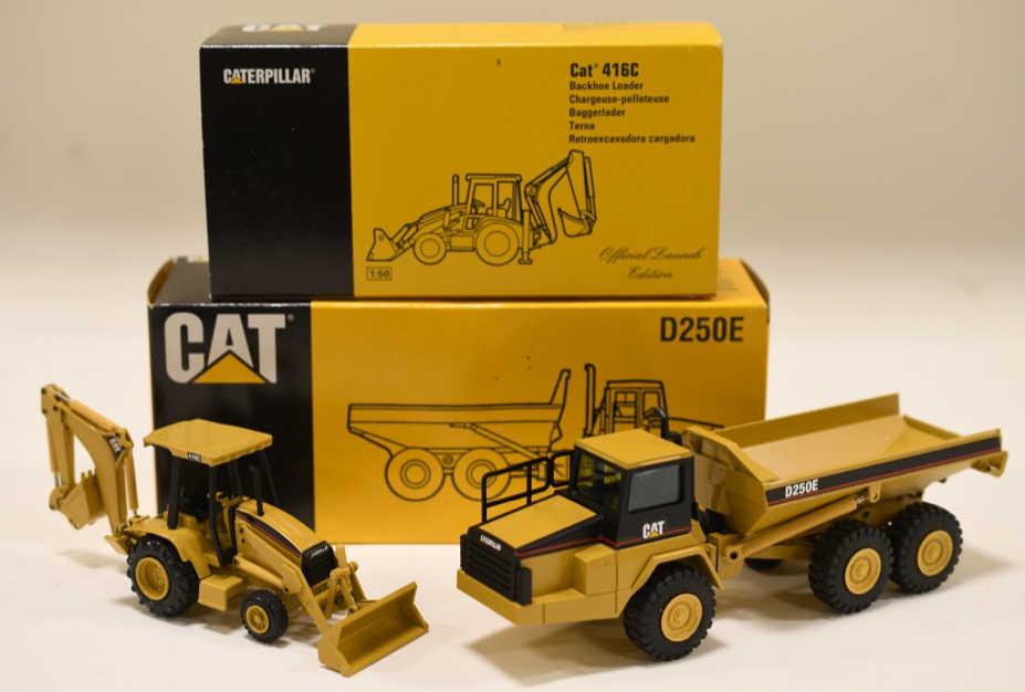 1/50 Conrad NZG Cat Dump Truck & Backhoe Loader: Nice 1/50 scale NZG Conrad Caterpillar Cat D250E articulated truck and Cat 416C backhoe loader. Both display nicely with the box. They have light wear from display and storage.