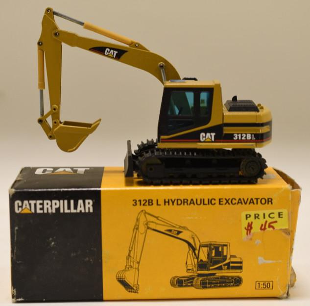 1/50 Conrad NZG Cat 312B Hydraulic Excavator: Nice 1/50 scale NZG Conrad Caterpillar Cat 312B L Hydraulic Excavator. Displays nicely in the box. Has light wear from display and storage.