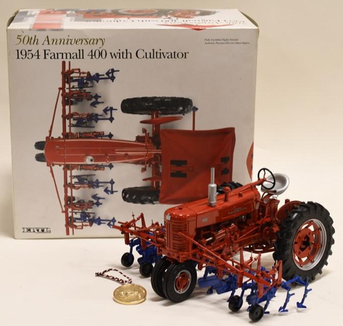 1/16 Ertl 1954 Farmall 400 w/ Cultivator: Nice Ertl 1/16 scale die-cast 1954 Farmall 400 with cultivator 50th anniversary. Comes with original box and medallion. Missing the umbrella and rear cultivator. In nice condition with light wear from