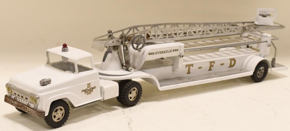White Tonka No. 5 Aeriel Ladder Fire Truck: Nice White Tonka No. 5 Aeriel ladder fire truck. Nice condition with wear from play and age. Displays nicely with older restoration. Measures approximately 32" long overall.