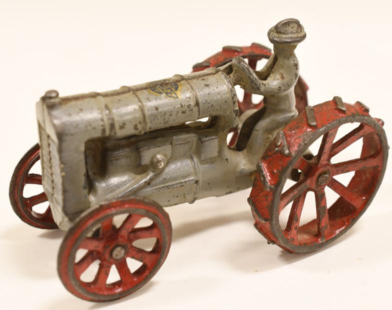 Cast Iron Arcade Fordson Tractor No. 2741: Nice vintage cast iron Arcade Fordson tractor no.2741. Nice condition with some paint loss and wear from use and age.. Displays very well with Arcade decal still intact. It measures approximately 4-1/