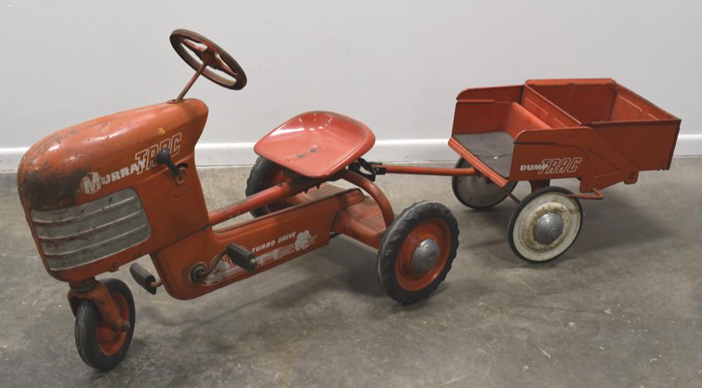 Murray Trac Pedal Tractor W/ Dump Trailer: Vintage Murray Trac pedal tractor with dump trailer. Has paint loss and wear from play and age. Displays nicely for age. Measures approximately 66" long.