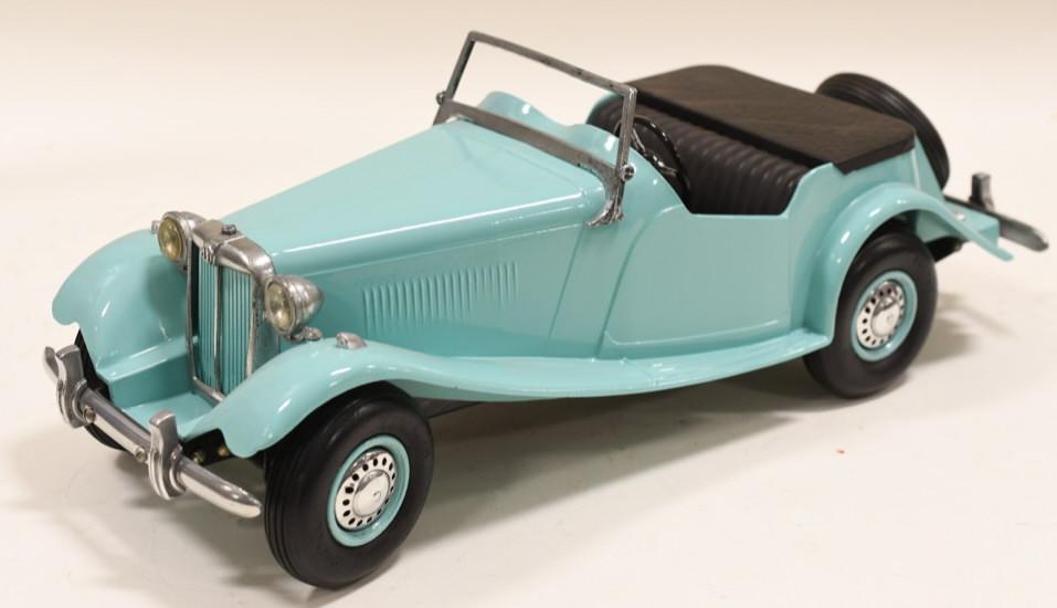 Restored 1950's Doepke Model Toys MG Car: Very nice professionally restored Doepke Model Toys MG Car. Displays very nicely with light wear from display. Measures approximately 15" long.