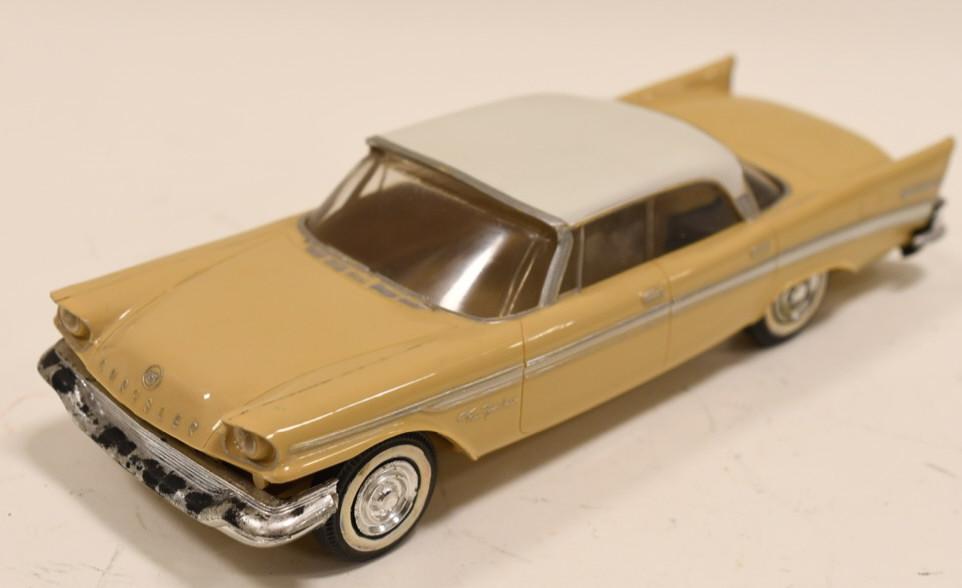 1957 Chrysler New Yorker Promo Car: Nice 1957 Chrysler New Yorker Promo Car by Jo-Han models. Made of plastic with friction power. Friction does not work. Displays nicely with wear from age and play. Measures approximately 8 1/2" long.