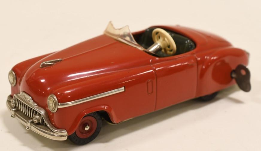German Tin Windup Schuco Combinato 4003 Car: Nice German tin windup Shuco Combinato 4003 toy car. One of the wheels is rubbing on the fender so the windup does not work. Caris in nice condtion with light wear from age and play. Measures approxim