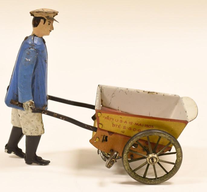 Early Lehmann Tap Tap Tin Windup Man w/ Cart: Nice tin litho windup Lehmann Tap Tap. Displays very nicely with wear from age and play. Windup works when toy is held in the air, but not when set on a surface. Measures approximately 6 1/2" long.