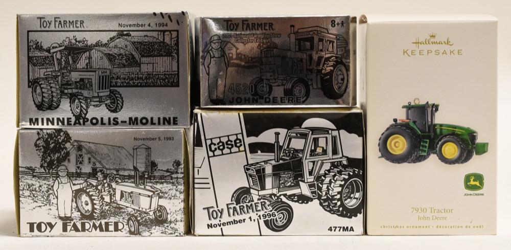 1/64 and 1/43 Scale Toy Tractors John Deere, Case: Nice lot of 4 Ertl Toy Farmer tractors and a John Deere Hallmark Keepsake. All display nicely with wear from age.
