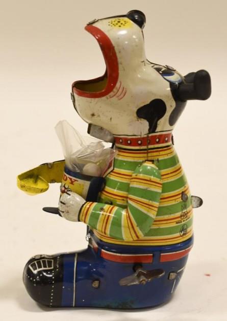 TPS Tin Litho Windup Candy Loving Canine: Nice vintage TPS Japan tin litho windup candy loving canine toy. Displays nicely with light wear from age and play. Windup mechanism works. Measures approximately 5 1/2" tall.