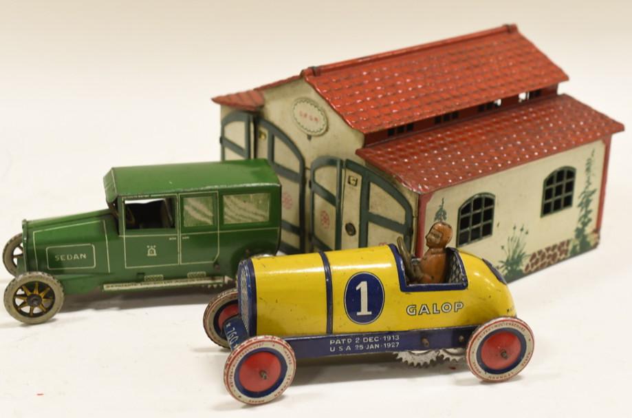 Lehmann Tin Litho Garage w/ Racer & Sedan: Nice scarce tin litho Lehmann garage 772 with cars set. Displays very nicely with paint loss and wear from play and age. Cars include a Lehmann #1 racer and a Green Sedan. Very nice set. Garage measur
