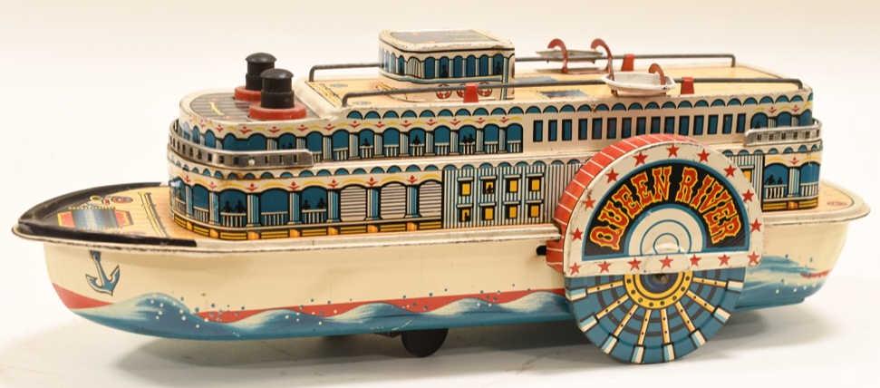 Tin Litho Modern Toys Battery Op. Queen River Boat: Nice tin litho battery operated Modern Toys Queen River sidewheeler boat. Displays nicely with paint loss and wear from play and age. Measures approximately 13" long.