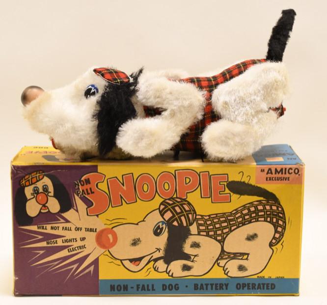 Amico Japan Battery Op. Non-Fall Snoopie Dog: Nice vintage Amico Japan battery operated non-fall Snoopie Dog with box. Displays nicely with wear from play and age. Untested. Measures approximately 12" long.