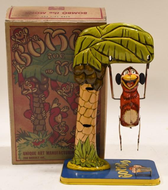 Tin Windup Unique Art Bombo The Monk: Nice tin litho windup Unique Art Bombo The Monk. Box is a reproduction. Missing the key. Displays nicely with wear from age. Measures approximately 10" tall.