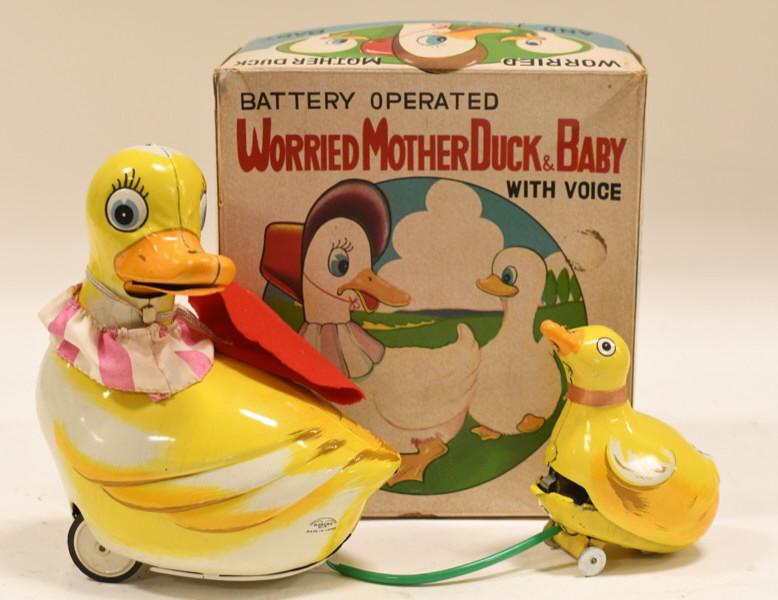 Japan Tin Battery Op. Worried Mother Duck & Baby: Nice tin litho battery operated worried mother duck & baby with voice. Dislays nicely with wear from play and age. Comes with the original box. Measures approximately 7" tall.