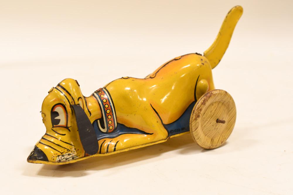 Marx Tin Litho Windup Walt Disney Pluto: Nice Marx tin litho windup Walt Disney Pluto has a date of 1939. Displays nicely with wear from play and age. Measures approximately 9 1/2" long.