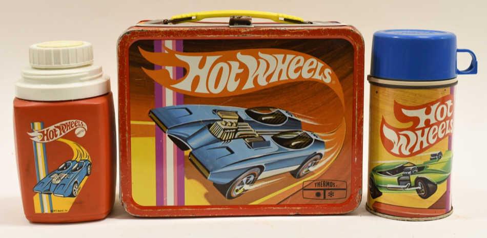 1969 Thermos Hot Wheels Metal Lunch Box: Nice 1969 Thermos Hot Wheels metal lunch box with thermos. Lunch box has paint loss and wear from use and age. Displays nicely. Measures approximately 8 3/4" across.
