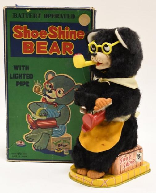 T.N Japan Battery Operated Shoe Shine Bear: Nice T.N Japan battery operated Shoe Shine Bear in the box. Displays nicely with wear from play and age. Untested. Has some fur loss. Measures approximately 8 3/4" tall.