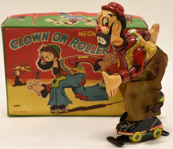T.P.S. Tin Windup Clown On Roller Skate: Nice vintage T.P.S. tin litho wind up Clown On Roller Skate with reproduction box. Cosmetically the cloth pants have some discoloration. Measures approximately 6" tall.