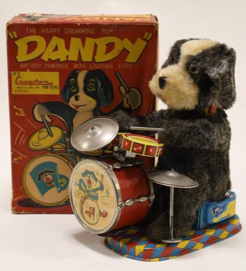 Cragstan Battery Op. Dandy The Happy Drumming Pup: Nice Cragstan battery operated Dandy the happy drumming pup in box. Displays nicely with wear from play and age. Measures approximately 9" tall.