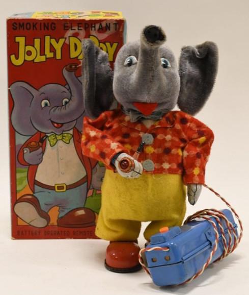 Marusan Battery Op. Smoking Elephant Jolly Daddy: Nice Marusan battery operated smoking elephant Jolly Daddy with box. Displays nicely with wear from play and age. Untested. Measures approximately 9" tall.