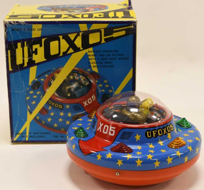 Modern Toys Tin Battery Op. UFO X05 Flying Saucer: Nice Modern Toys tin battery operated UFO X05 flying saucer. Battery compartment is clean. Displays very nicely with light wear from age. Measures approximately 7 1/2" across.