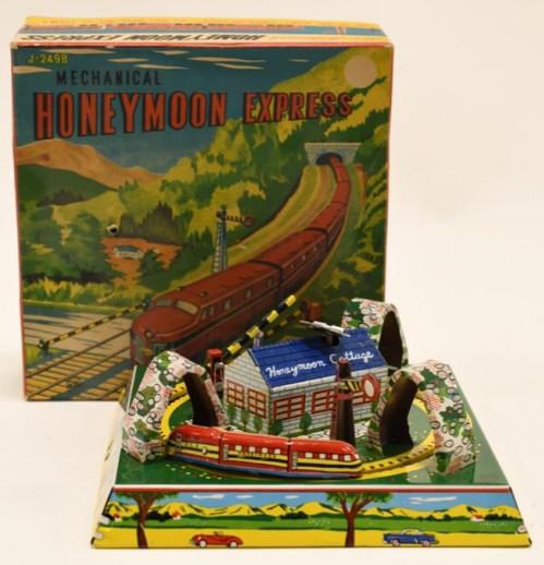 Linemar Mechanical Tin Honeymoon Express: Nice Linemar mechanical tin honeymoon express with box. Windup mechanism works, but sometimes needs help. Displys nicely with wear from play and age. Measures approximately 7" long by 7" across.