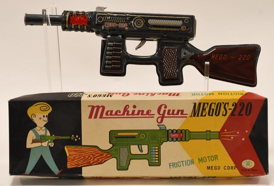 Modern Toys Tin Litho Machine Gun Mego's-220: Nice Japan Modern Toys tin litho machine gun Mego's-220 with box. Displays nicely with some wear from age and play. Measures approximately 14" long.