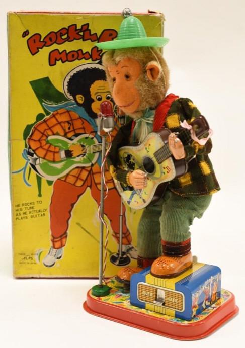 Alps Battery Op. Rock N Roll Monkey: Nice Alps battery operated Rock N Roll monkey in box. Box has wear and tear from age. Monkey displays nicely with some wear from play and age. Untested. Measures approximately 12" tall.