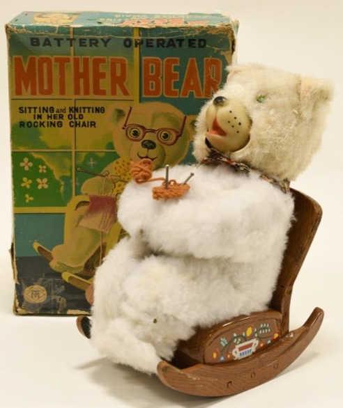 Modern Toys Battery Op. Mother Bear Knitting: Nice Modern Toys Japan battery operated mother bear knitting and sitting with box. Box has wear and tear. Toy displays nicely with some wear from age. Untested. Measures approximately 9 1/2" tall.
