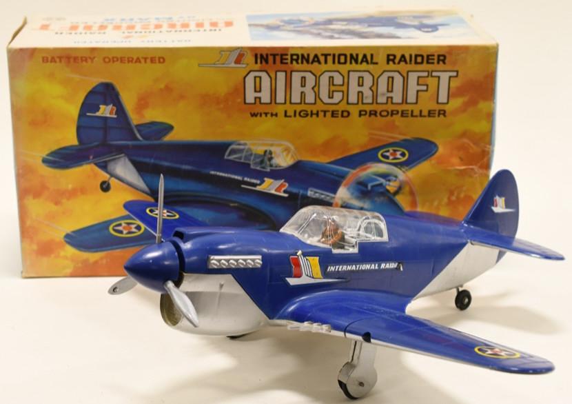 Marx Battery Op. International Raider Aircraft: Nice Marx battery operated International Raider Aircraft in box. Displays nicely with some wear from age and play. Untested. Measures approximately 15" across.