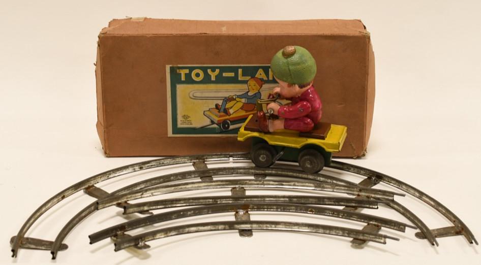 C.K Japan Toy-Land Windup Train Hand Car Set: Nice C.K Japan Toy-Land windup train hand car in box. Displays nicely with some wear from age and play. The guy is made of celluloid. Windup mechanism works. Box measures approximately 12" across.