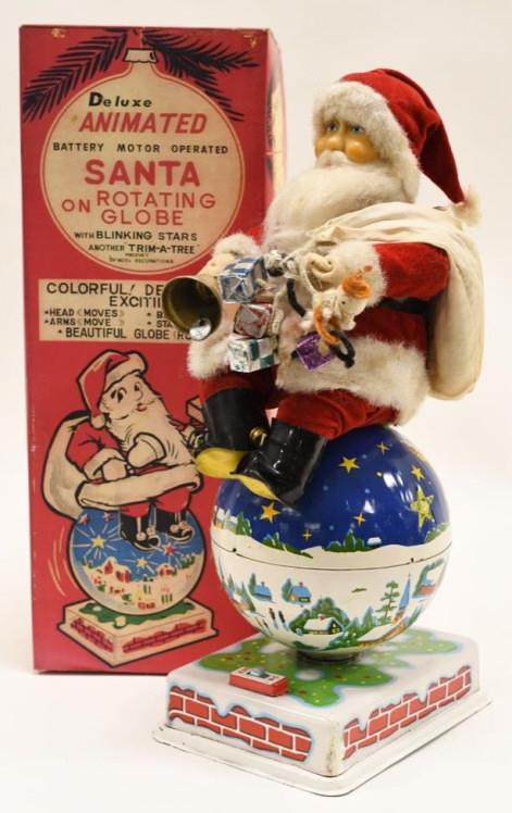 Noel Decoration Battery Op Santa on Rotating Globe: Nice Noel Decorations Japan battery operated Santa Claus on rotating globe with reproduction box. Displays nicely with wear from play and age. Untested. Measures approximately 15" tall.
