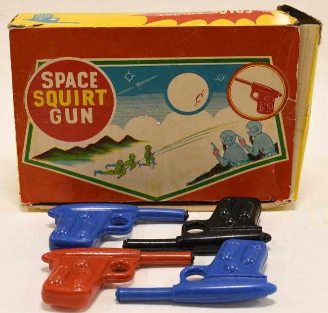 R.L. Albert & Son Space Squirt Water Gun: Nice R.L. Albert & Son Space Squirt water gun in the box. Includes 15 guns. Displays nicely with wear from age and play. Each gun measures approximately 5" across.