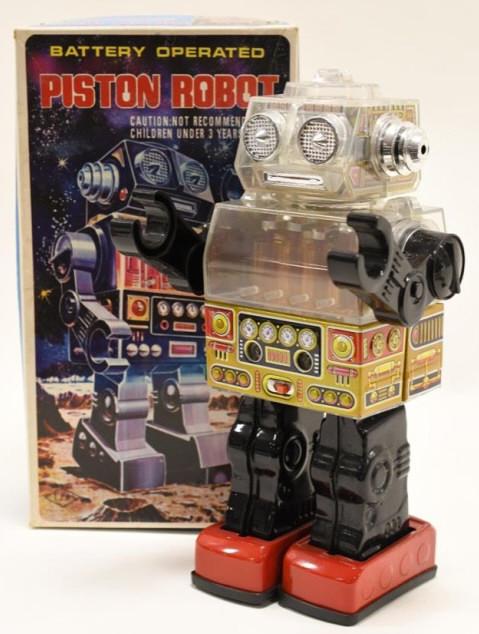 S.J.M. Tin Battery Op. Piston Robot: Nice S.J.M. tin battery operated Piston Robot with box. Made in Taiwan. Displays nicely with wear from display and age. Measures approximately 10" tall.