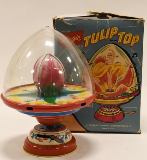 J. Chein Tin Magic Tulip Top Dancing Doll: Nice J. Chein tin magic tulip top dancing doll with box. Displays nicely with wear from play and age. Nice working condition. Box has some repairs and tear. Displays nicely. Measures approximately 10"
