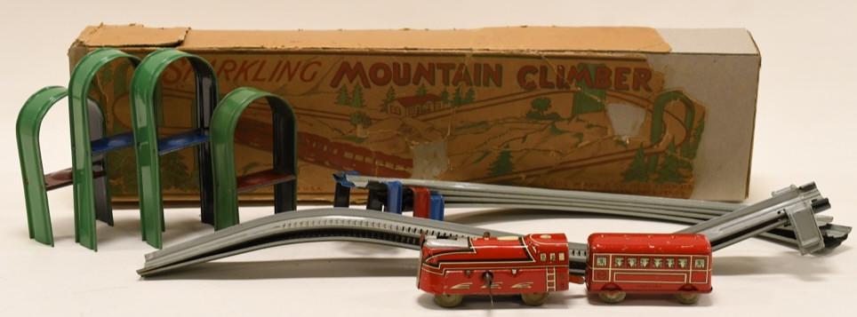 Marx Tin Sparkling Mountain Climber Train Set: Nice Marx tin windup sparkling mountain climber train set in box. Box is in rough condition. Set displays nicely with some wear from age and play. Box measures approximately 23" long.