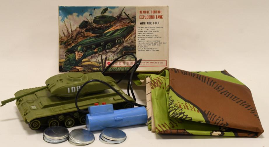 Sears Remote Control Exploding Tank: Nice Sears remote control exploding tank with original box. Box has wear from age and display. Toy appears to be complete. Even comes with the original map and landmines! Measures approximately 10" lo