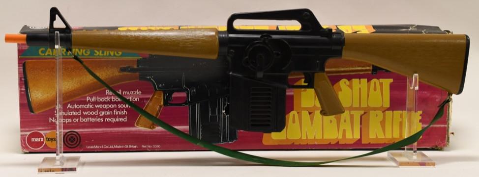Marx 50 Shot Combat Rifle with Weapon Sound: Nice vintage Marx 50 shot combat rifle with box. Rifle has a pull back bolt action with weapon sound. The rifle displays nicely in working condition. Box has some wear and tear. Measures approximately