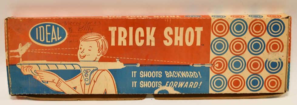 Ideal Toys Trick Shot Gun: Nice Ideal Toys trick shot gun with box. The box has some writing and wear from age and display. Displays nicely. The gun measures approximately 26 1/2" long.