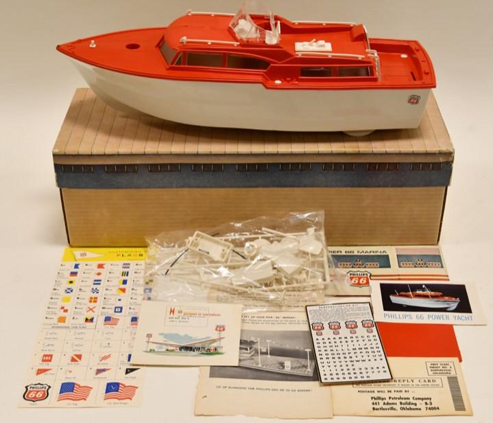 Phillips 66 Pier Marina Toy Boat Yacht: Nice Phillips 66 Pier Marina toy boat yacht with box. Box has wear from age. Toy displays nicely with the original Phillips 66 plastic around it. Boat is made of plastic. Measures approximately 16" ac