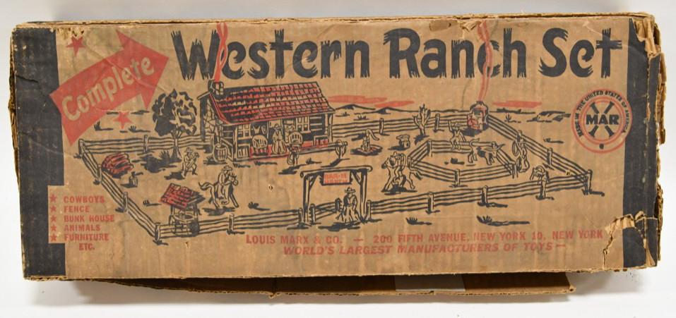 Marx Western Ranch Playset: Nice Marx Western Ranch playset. The box has wear from storage and display. Set includes, tin buildings, horses, fence, and accessories. Set has wear from play and age.