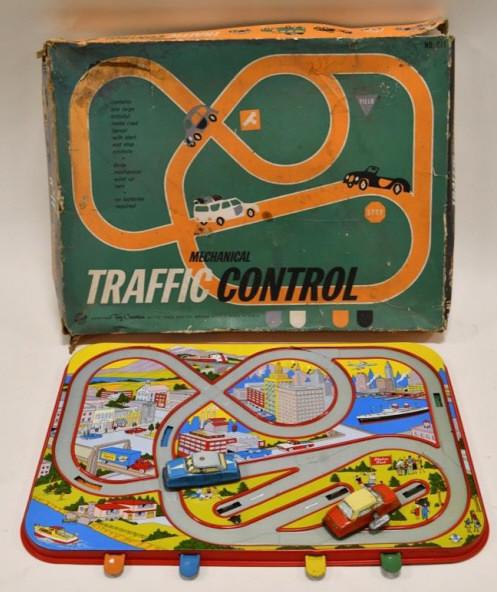 Ohio Art Tin Mechanical Traffic Control: Nice Ohio Art tin mechanical traffic control playset with original box. The box has some wear and tear from storage and display. The police car windup works, but the red car does not. The road measure