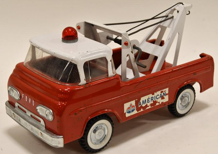 Nylint Ford Amoco Wrecker Tow Truck: Nice Nylint Ford Amoco wrecker tow truck. Displays nicely with some paint loss and wear from play and age. It has wear to the Amoco decals. Measures approximately 11" long.