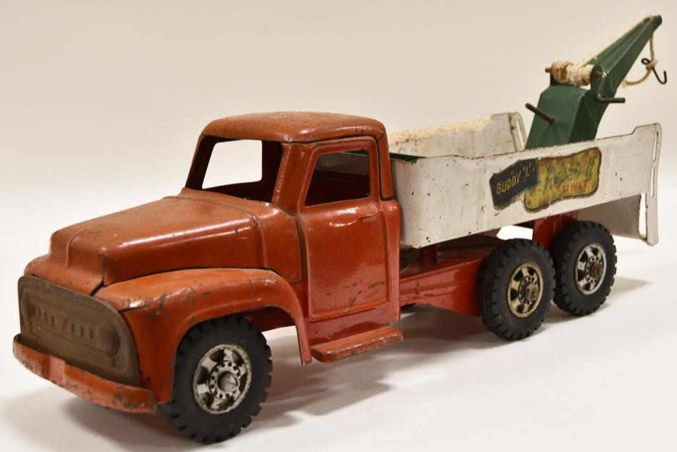 Buddy L Repair-It Unit Wrecker Truck: Nice Buddy L Repair-It Unit wrecker truck. Truck is in nice condition with wear from play and age. Displays nicely with the "Buddy L Repair It Service" decals. The truck appears to have been touched u
