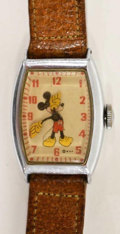 1940's Mickey Mouse US Time Wristwatch: 1940's Mickey Mouse US Time wrist watch with brown leather band. The back is stamped 6740 US Time. Displays nicely with wear from use and age. Not currently running.