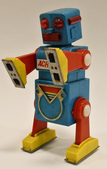 Yonezawa Battery Op. Acrobot Robot: Vintage Yonezawa plastic battery operated Acrobot Robot. The robot displays nicely with some wear from play and age. Toy is untested. Measures approximately 9" tall.
