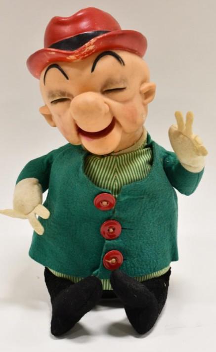 1962 Ideal Toys Mr. Magoo Plush Doll: 1962 Ideal Toys Mr. Magoo plush doll. Displays nicely with wear from play and age. Has some paint loss to the hat and face. Measures approximately 14" tall.