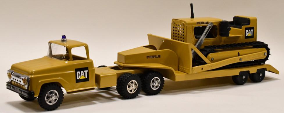 Custom Tonka Caterpillar Truck w/ Lowboy and Dozer: Beautiful custom Tonka Caterpillar truck with lowboy. Also comes with a custom Tonka Toys Caterpillar dozer. Displays nicely with a professional restoration. Overall measures approximatley 29 1/4" lon